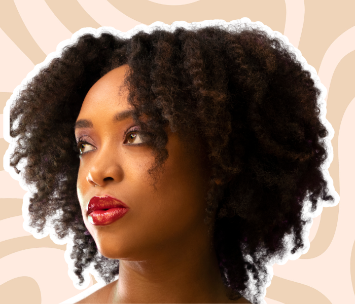 A woman with a styled twist out on her high-porosity 4C hair